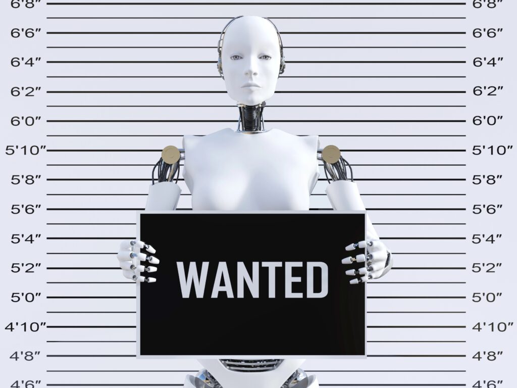 Roboter mit Schild "Wanted"